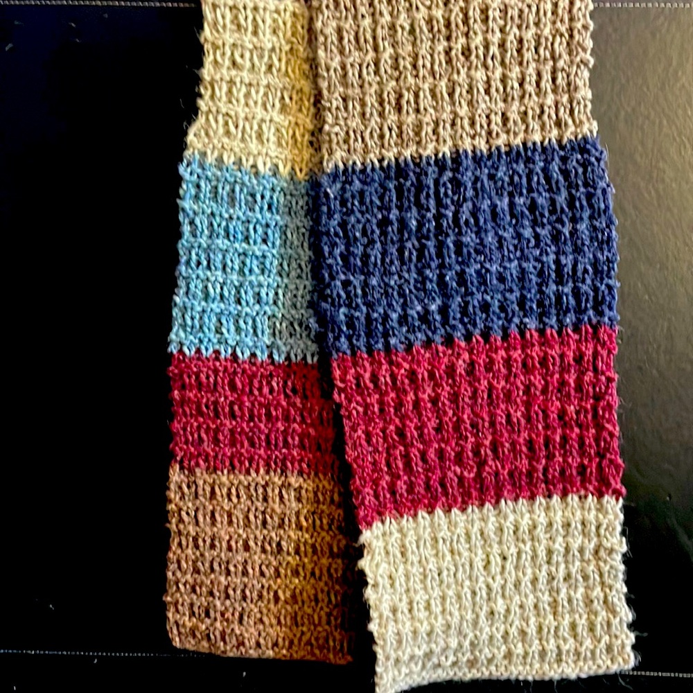 This Handwoven Scarf is 50 inches long with straight edges.
